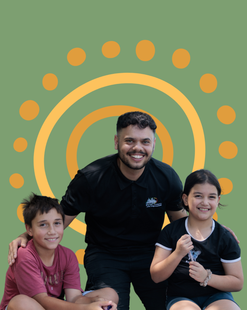Young man and two kids smiling on a green tile.
